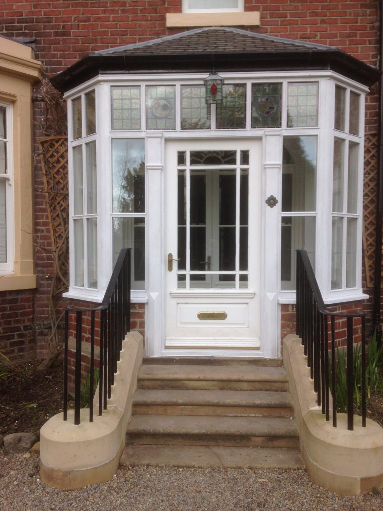 Original leaded lights faithfully restored and re-used in new porch